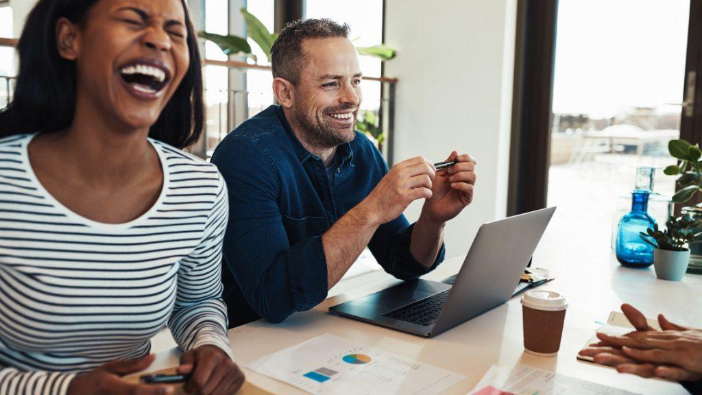 People interacting in a joyful workplace